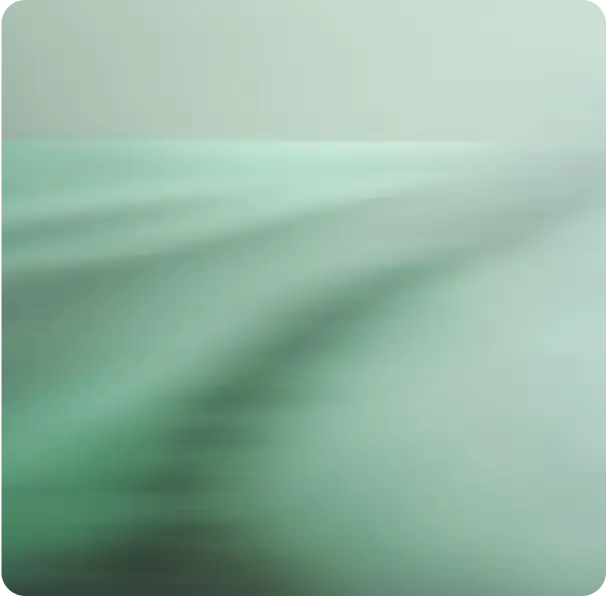 Blurred green surface with horizontal lines and a light gradient background.